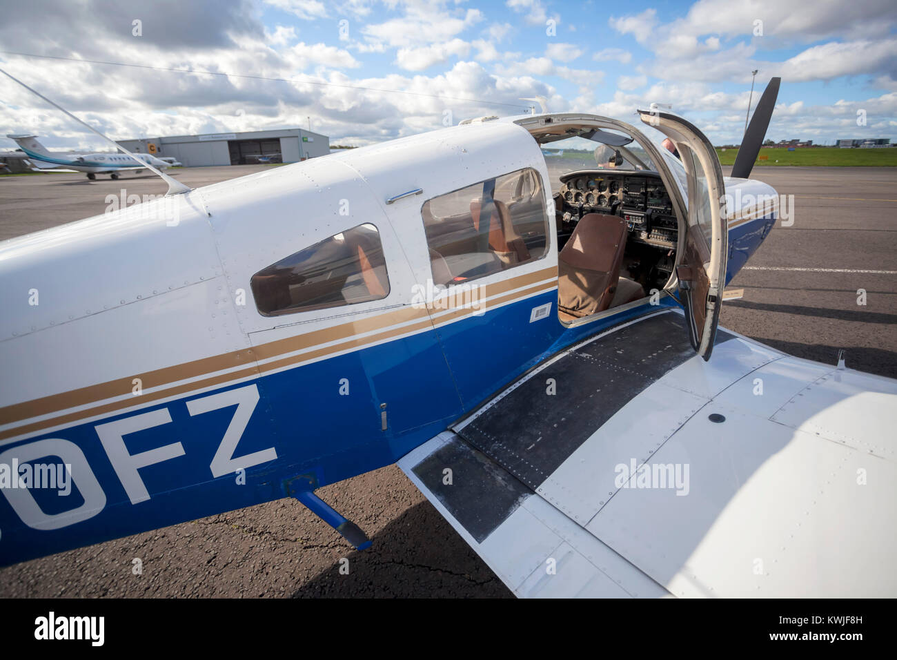 A door open showing the instrument panel of a Piper PA28 Cherokee