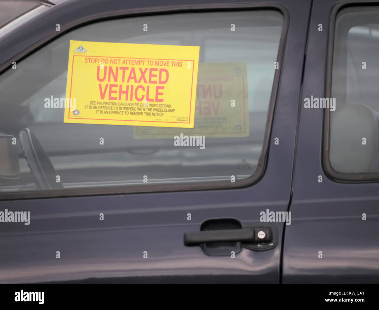 Black Untaxed Car with window sticker Stock Photo