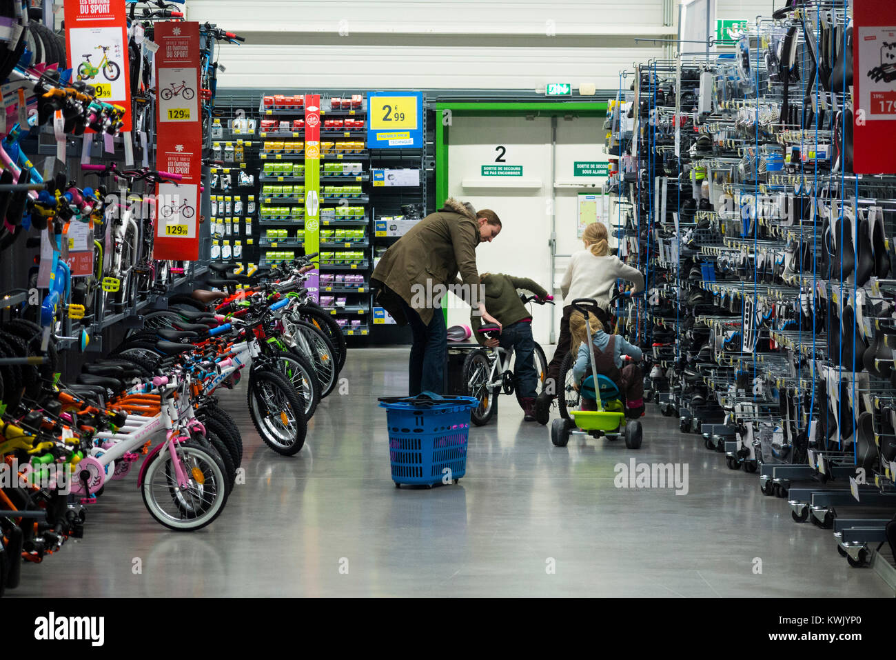 Children ride new bikes on sale in Decathlon store / shop / sports  equipment retailer in France / French superstore at Grésy-sur-Aix. France.  (93 Stock Photo - Alamy