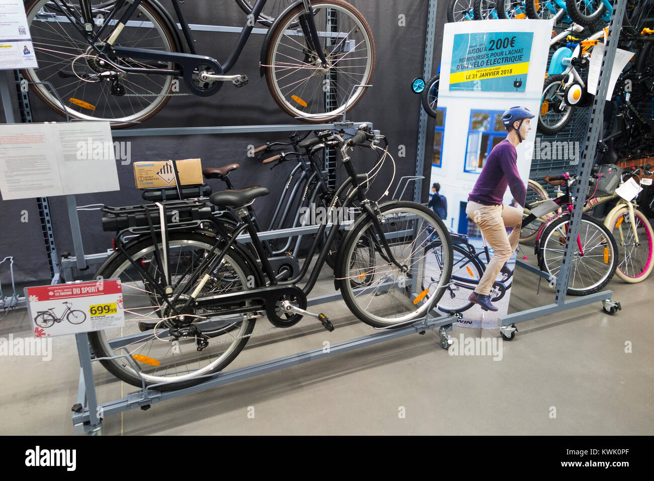 Electric powered bike / cycle / bicycle inside Decathlon sports / sporting  equipment shop / retailer / store Aix les Bains / Grésy-sur-Aix. France  Stock Photo - Alamy