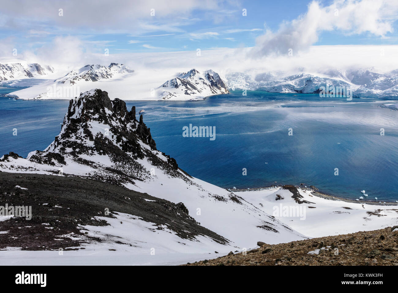 Ocean Adventurer cruise ship; Admiralty Bay; King George Island; snow & ice covered Antarctica landscape Stock Photo