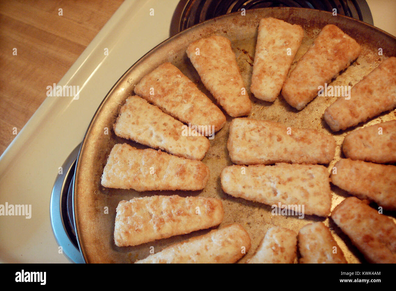 Frozen Fish Sticks on a Round Baking Pan Stock Photo - Alamy