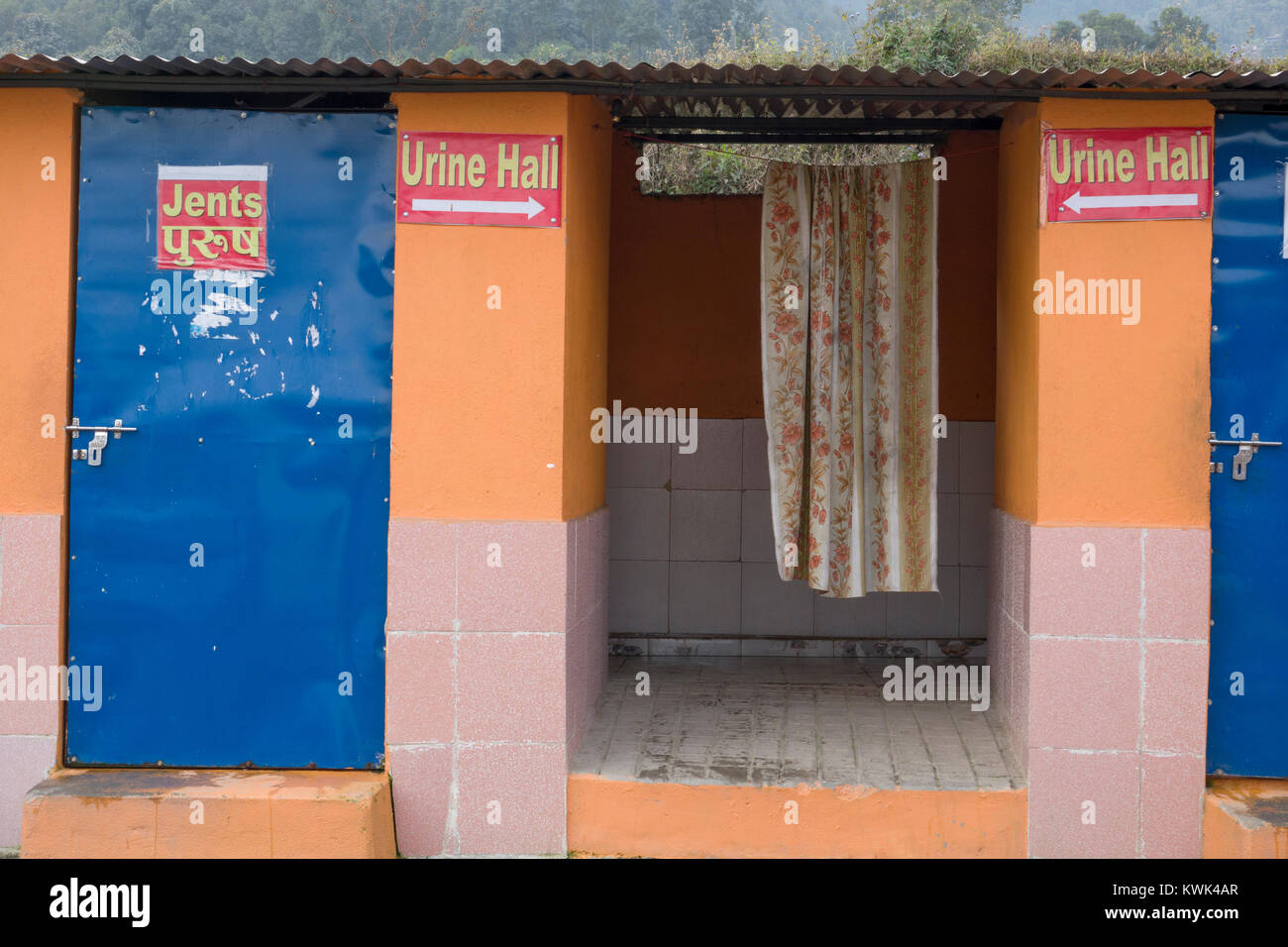 Men's urinal and toilet block with quirky signs Stock Photo Alamy