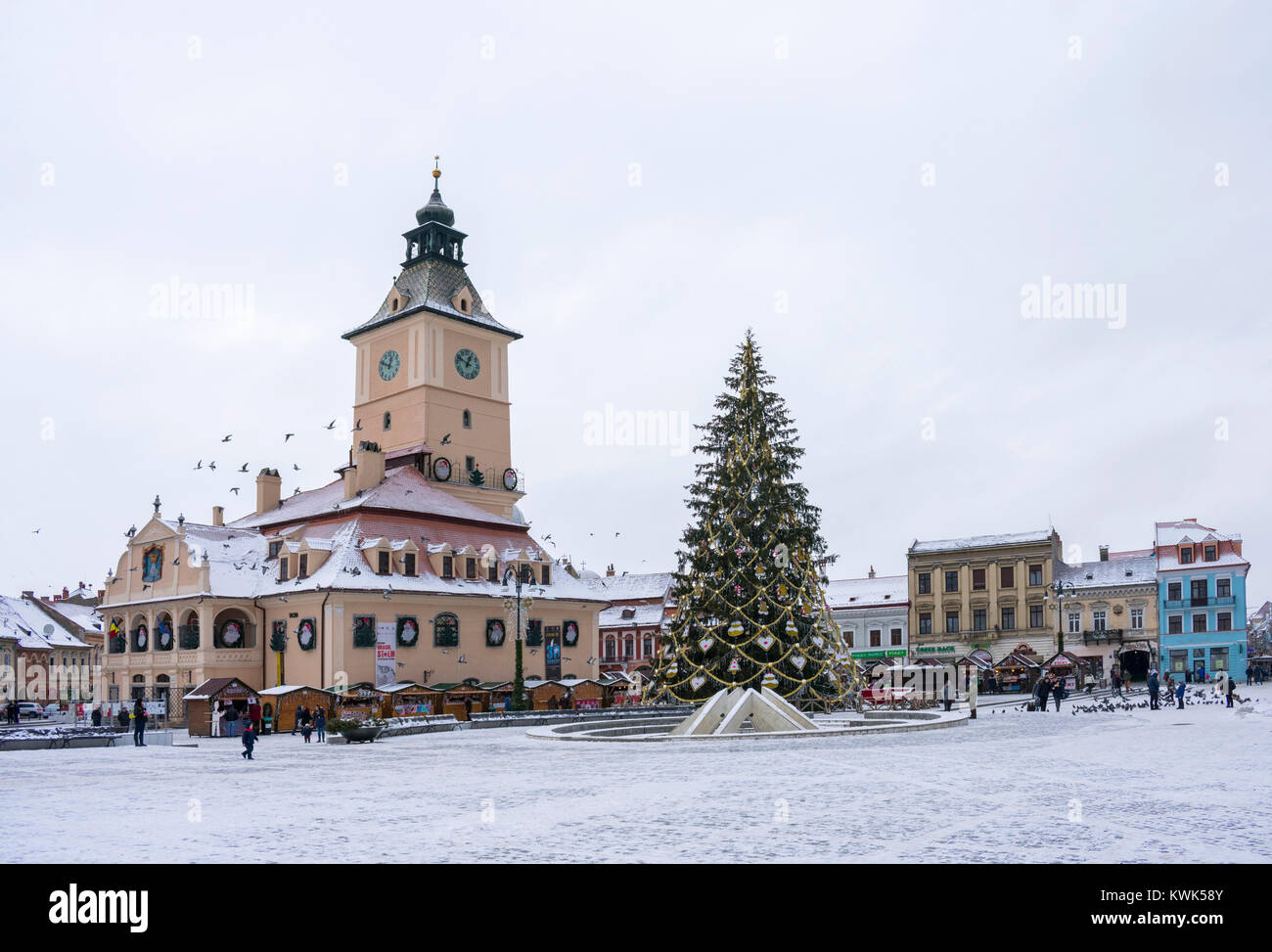 Brasov , Transylvania region, Romania, main town square and tower clock building , Christmas decorated  tree for the winter fair Stock Photo