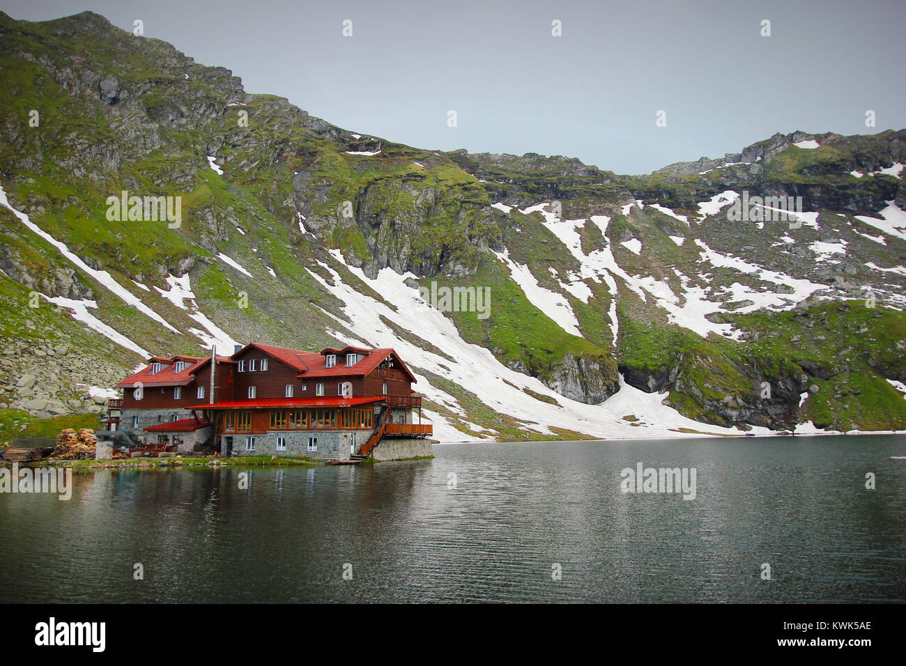 Panoramic view of Balea Lake and cabin with Fagaras Mountains background Stock Photo