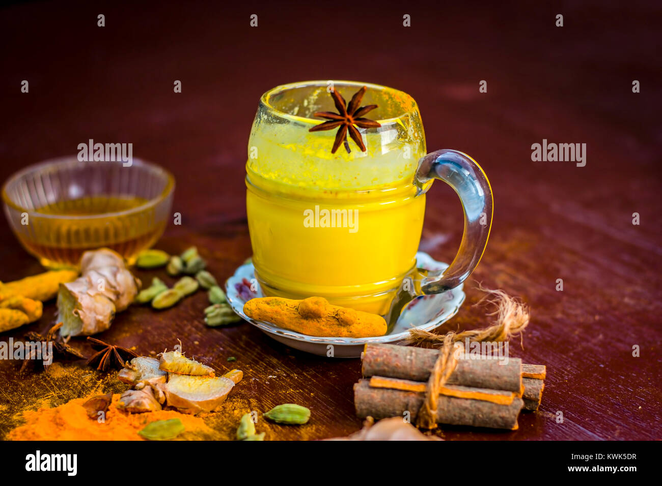 Golden milk with species like green cardamom,turmeric,cinnamon,honey