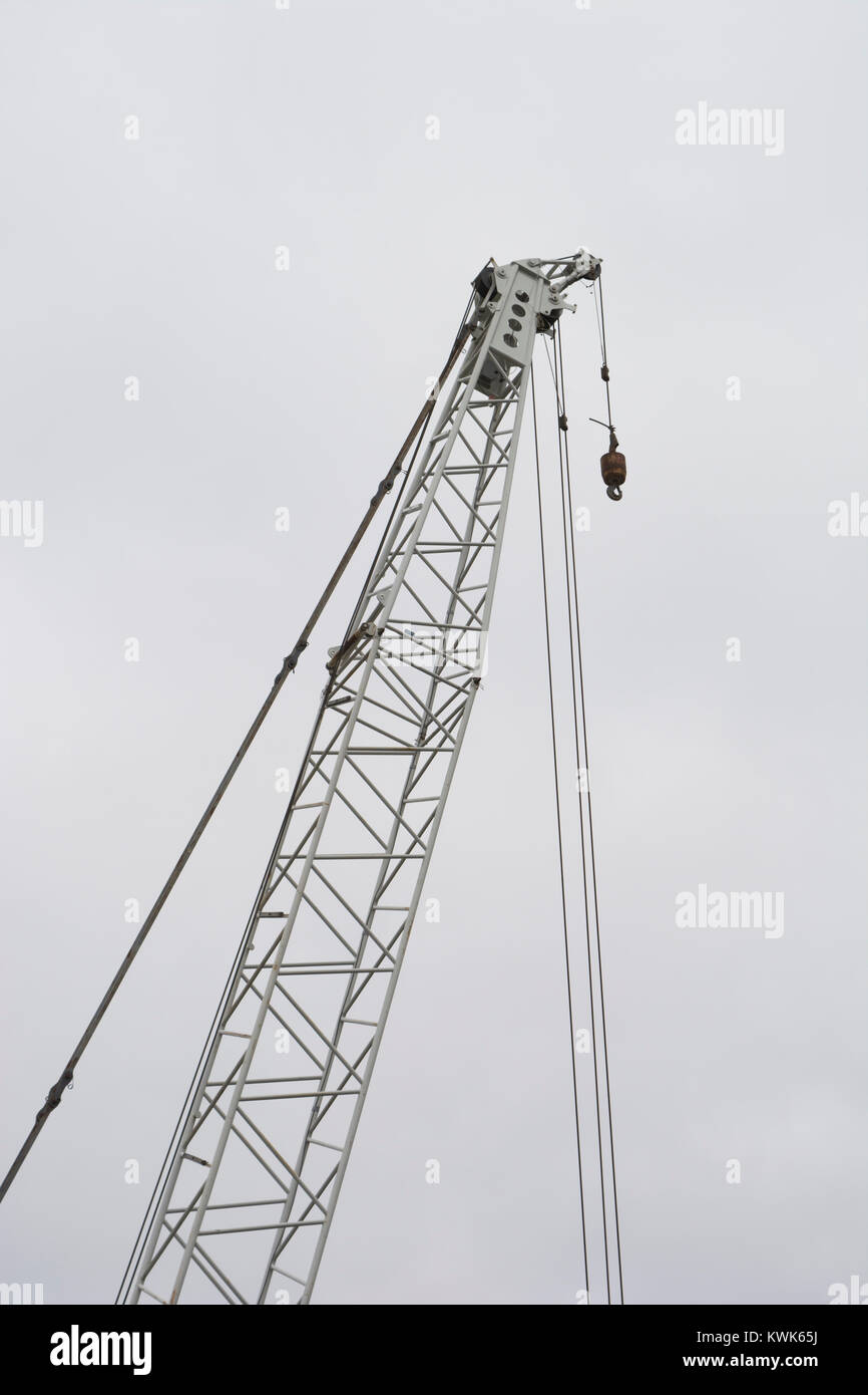 Crane top, with block and hook against a plain background supplied by a blanket of cloud at the dam at Kangaroo Creek Reservoir in the Adelaide Hills, Stock Photo