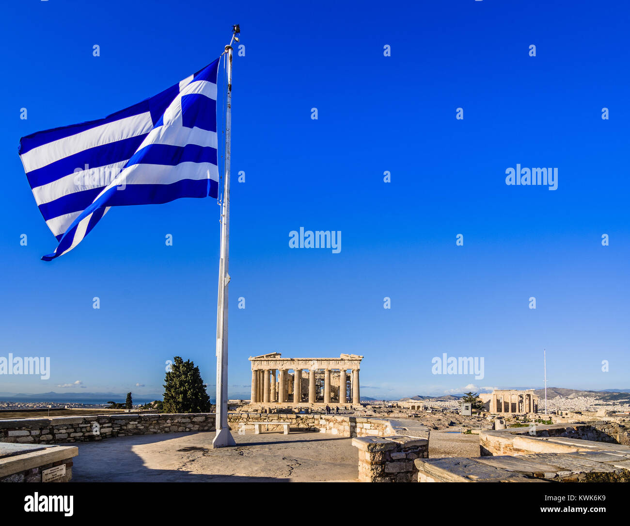 Greek flag in front of Parthenon temple on the Acropolis in Athens, Greece Stock Photo