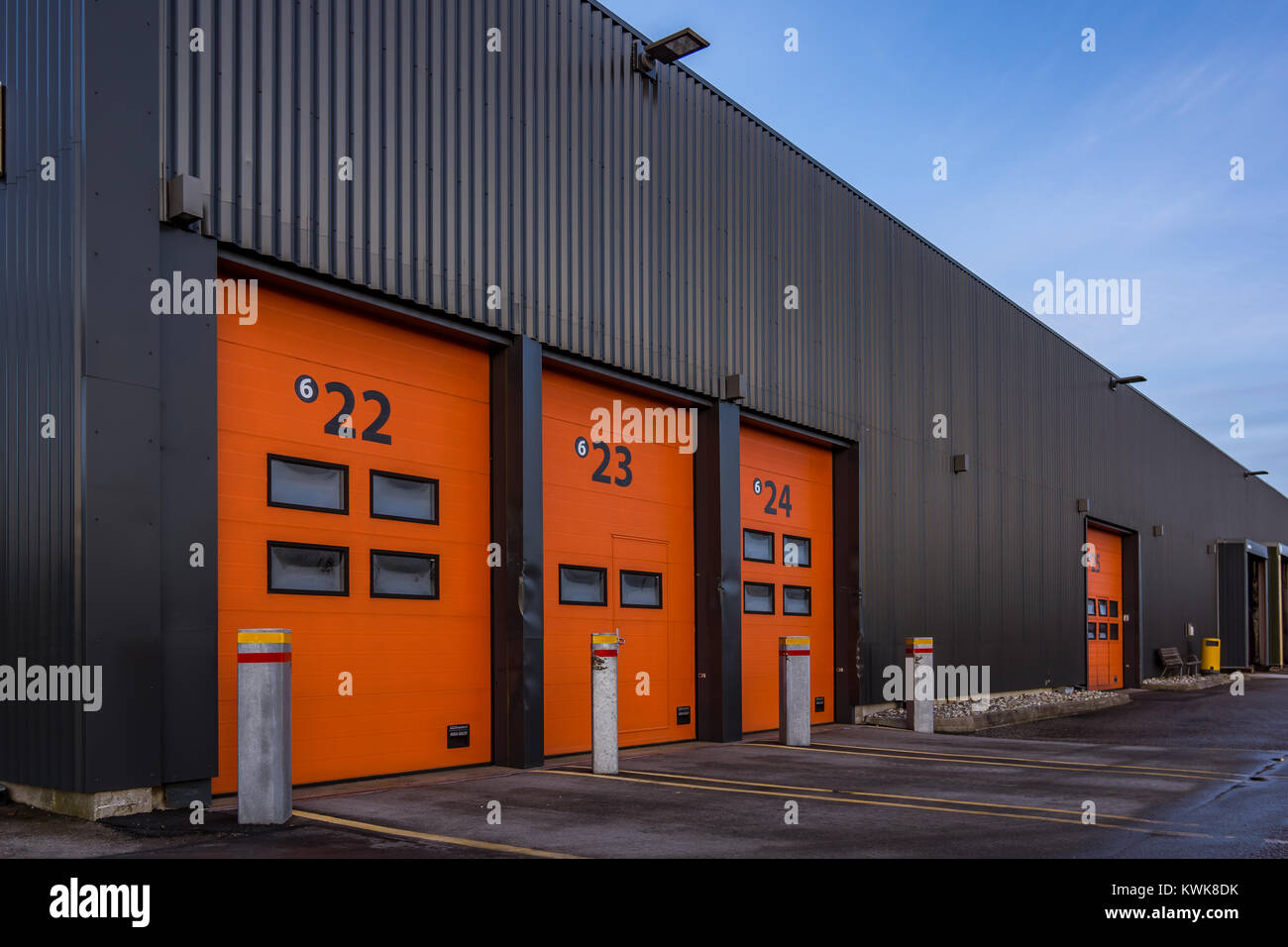 Red aluminum doors to  a black cargo building, Frederikssund, Denmark, January 2, 2018 Stock Photo