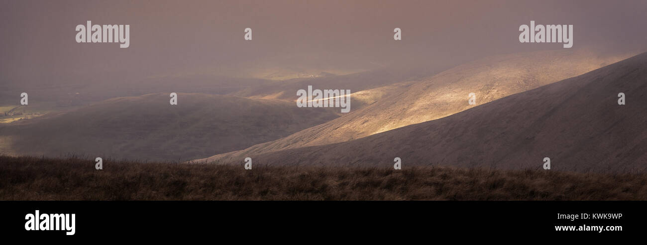 Low cloud and sunlight  over Howgill Fell, Cumbria, England, UK Stock Photo