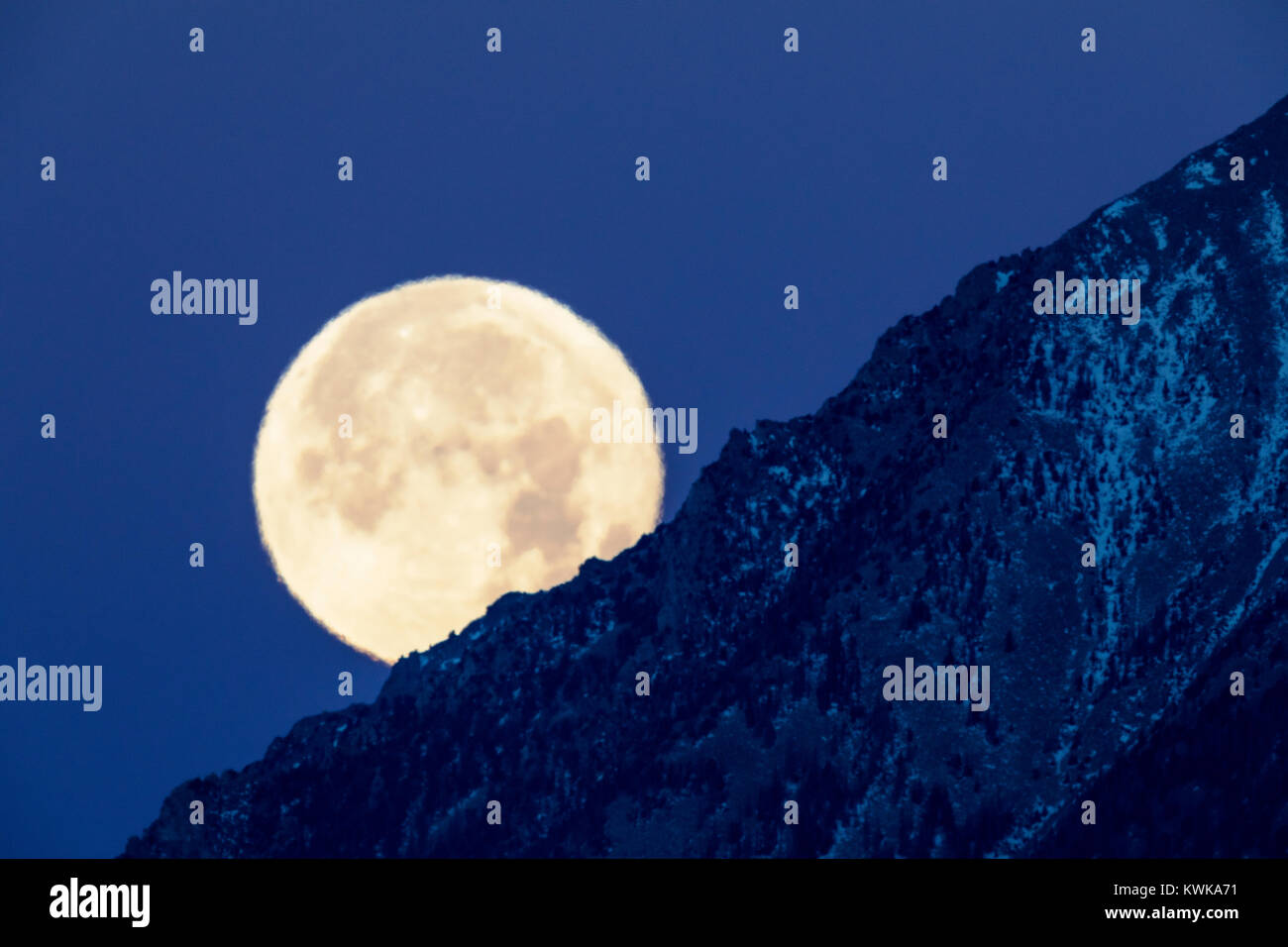 Full Super moon setting over Mt. Shavano; Rocky Mountains; Salida; Colorado; USA Stock Photo