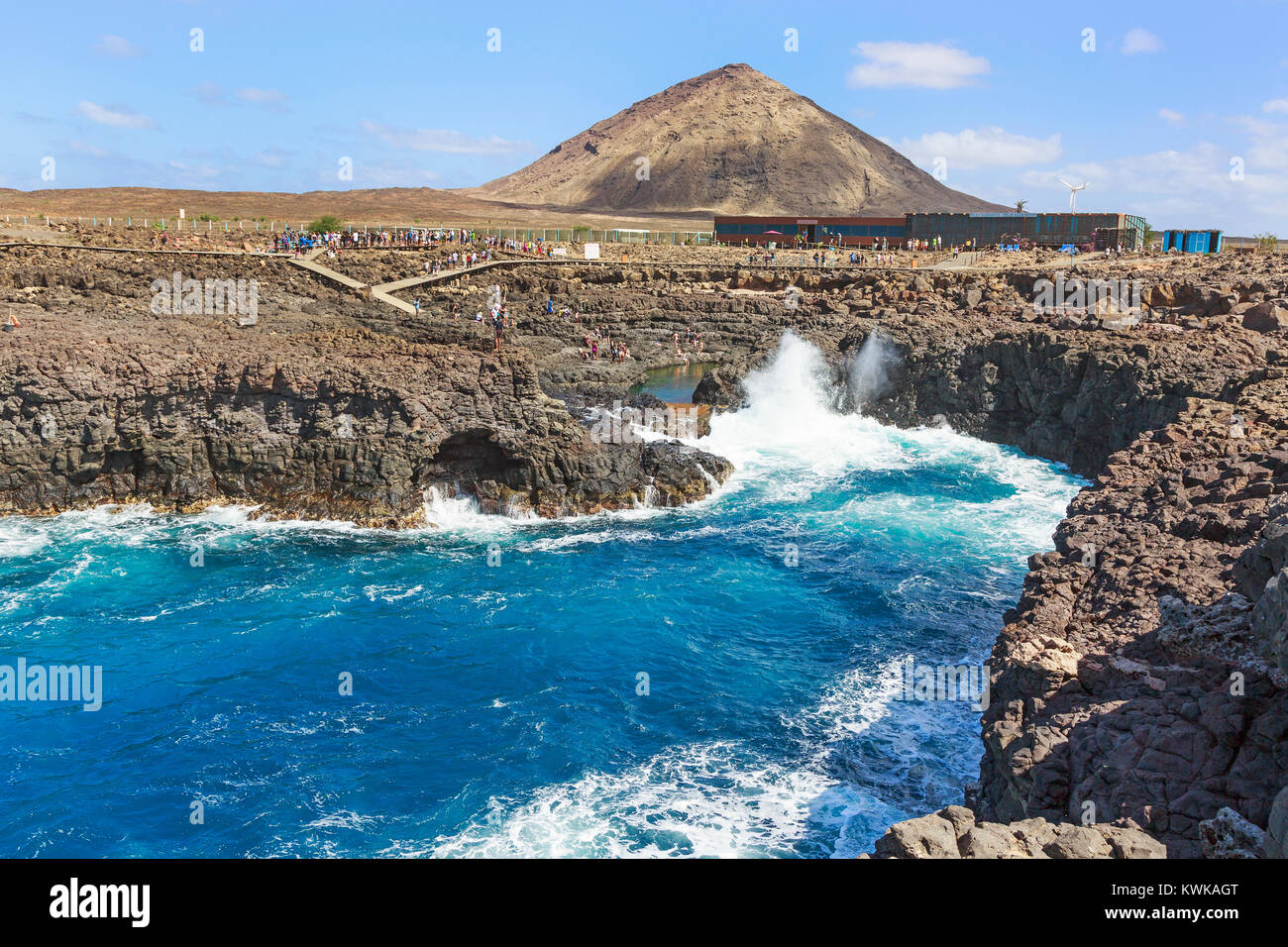 Naturally occurring swimming pool in the rocks at Baracona, at Terra Boa desert next to the mountain Grande Leste, Sal Island, Salinas, Cape Verde, Afr Stock Photo