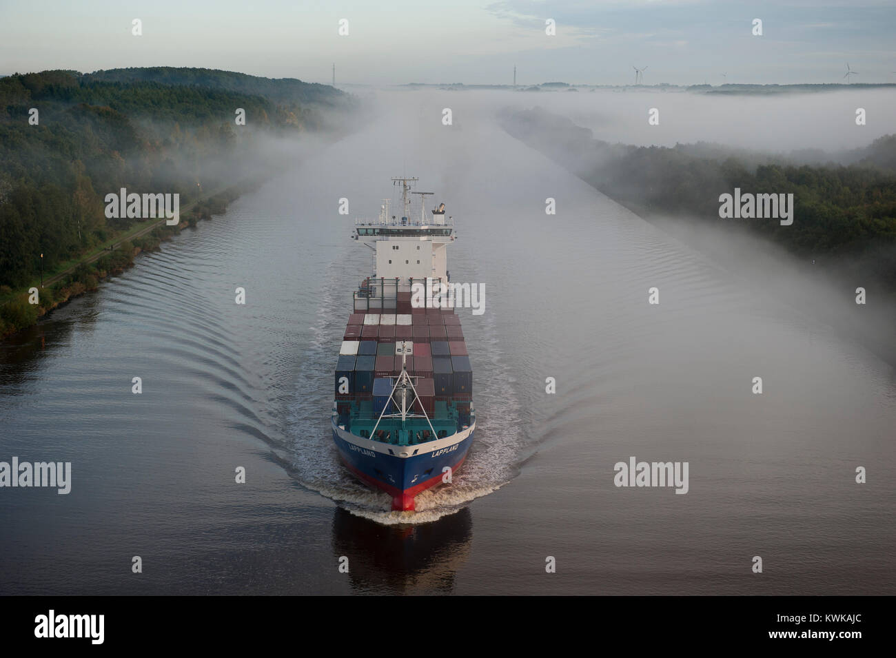 Germany , container ship in Kiel canal going from North sea to Baltic Sea Stock Photo