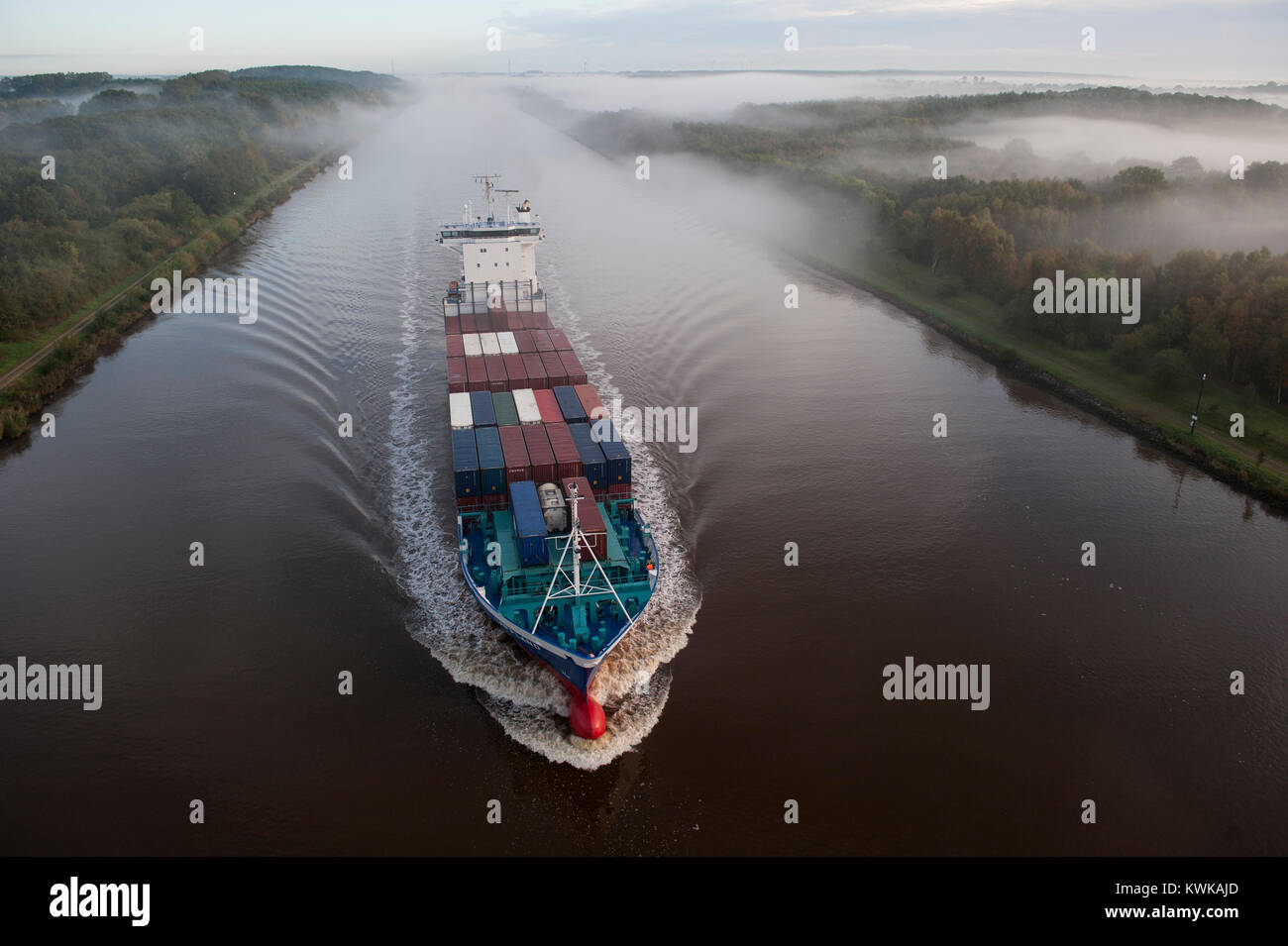 Germany , container ship in Kiel canal going from North sea to Baltic Sea Stock Photo