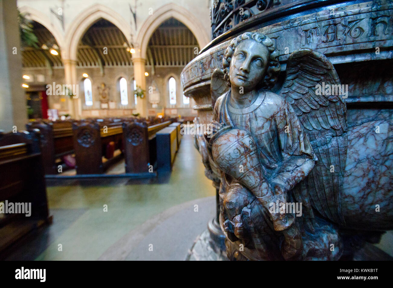 London, England, UK. St Mary Abbot's Church, Kensington. Angel on the marble font Stock Photo