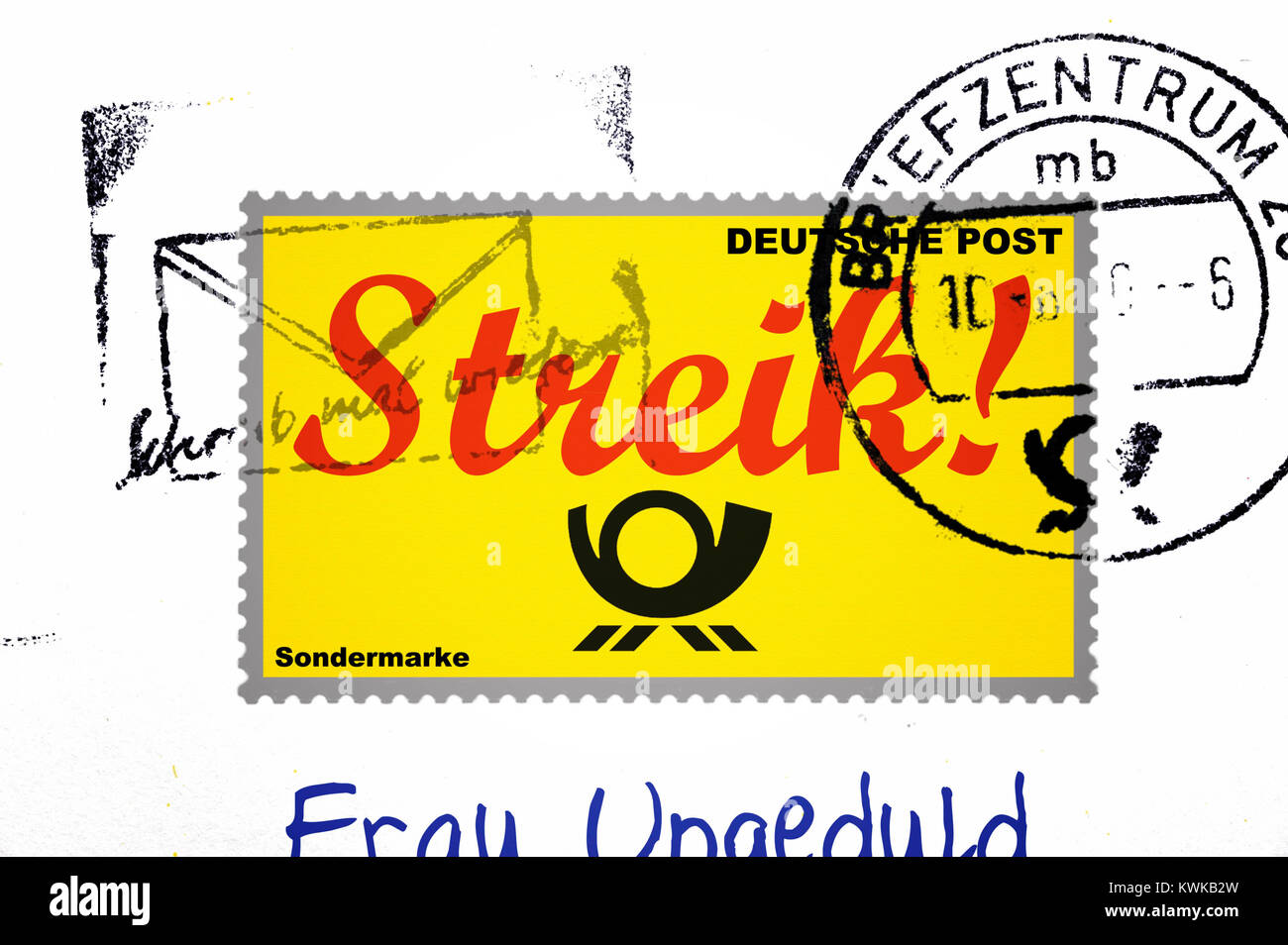 Stamp with strike stroke, symbolic photo postal strike, Briefmarke mit Streik-Schriftzug, Symbolfoto Post-Streik Stock Photo