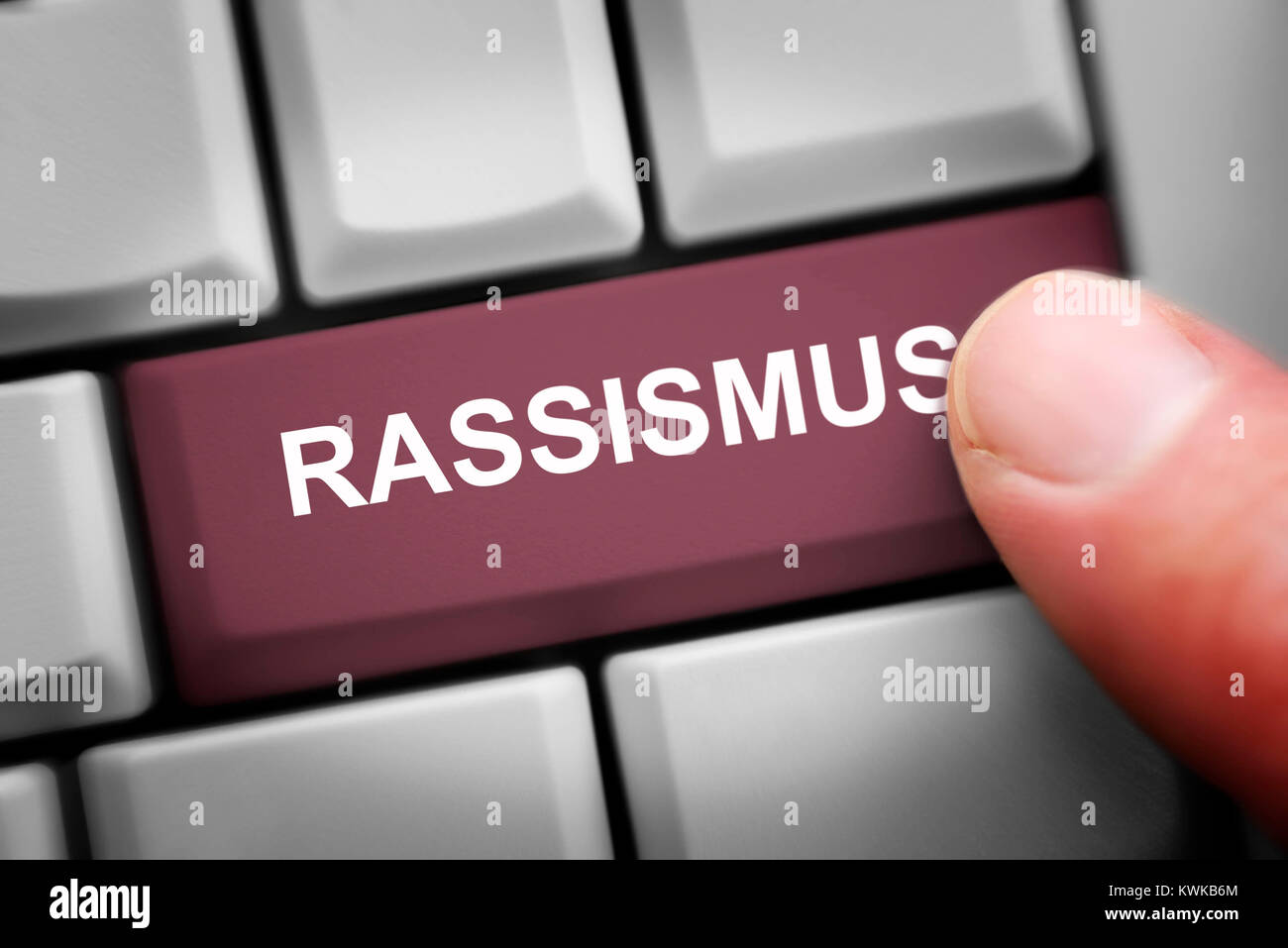 Computer key with the label Racism, racist Comments on social networks, Computertaste mit der Aufschrift Rassismus, rassistische Kommentare in soziale Stock Photo