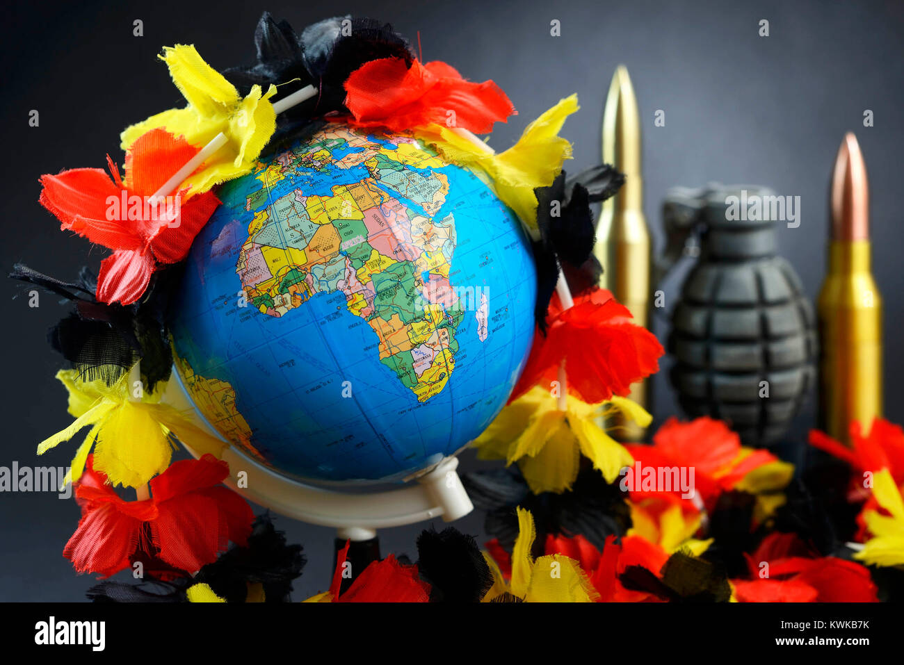 Globe with flower chain in German national colours, symbolic photo refugee's stream to Germany, Globus mit Blumenkette in deutschen Nationalfarben, Sy Stock Photo