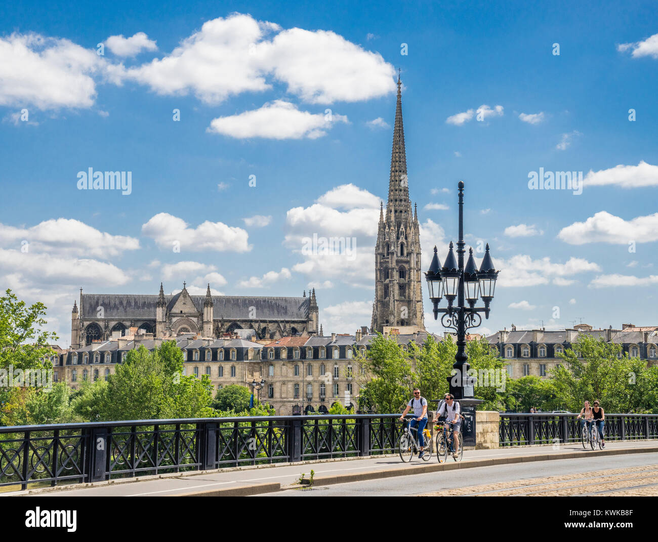 France, Gironde department, Bordeaux, Pont de Pierre (Pierre Bridge) over the Garonne River with view of Basilique Saint-Michel Stock Photo