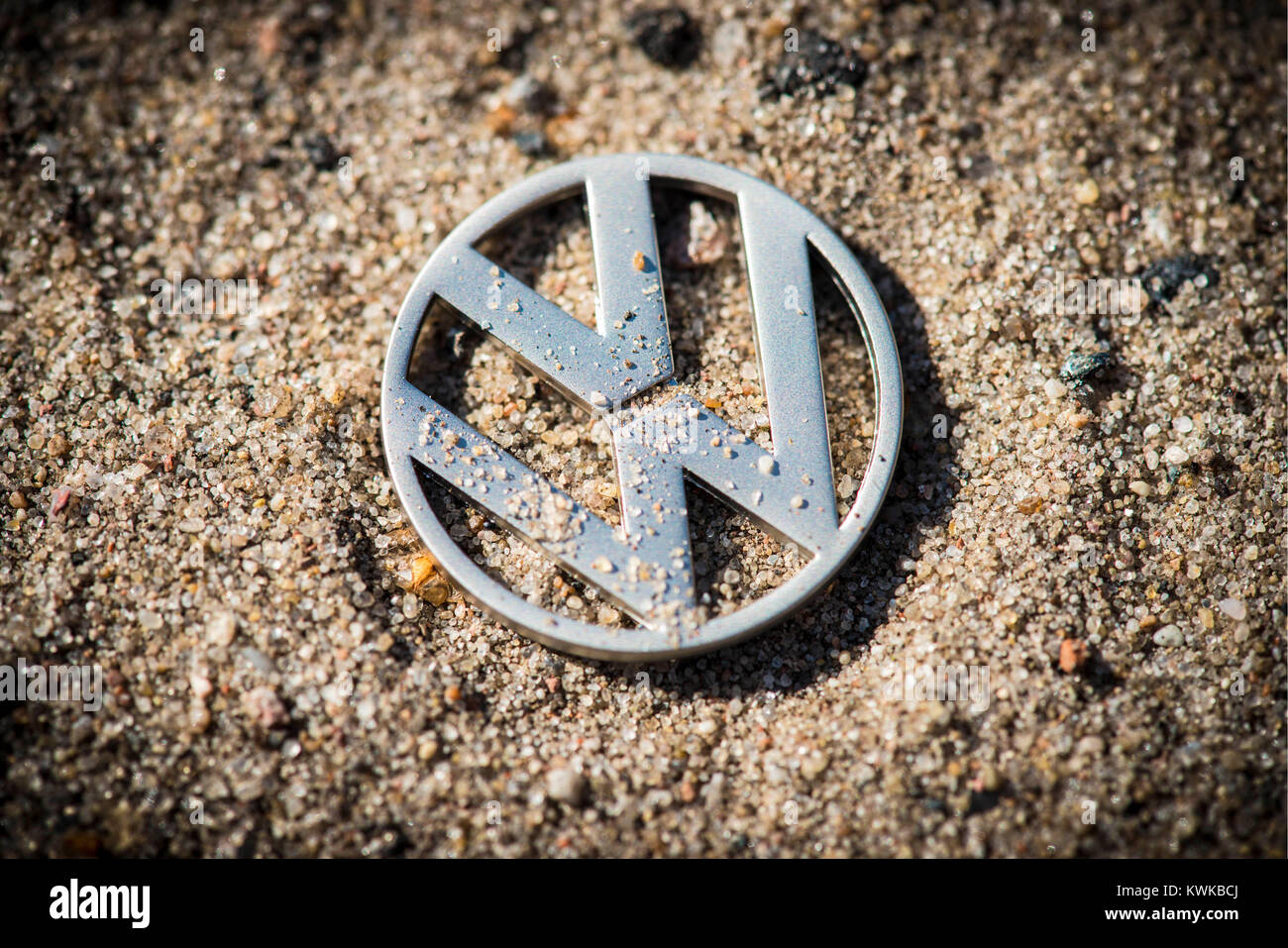 VW logo in the sand, symbolic photo VW-exhaust gas scandal, VW-Logo im Sand, Symbolfoto VW-Abgasskandal Stock Photo