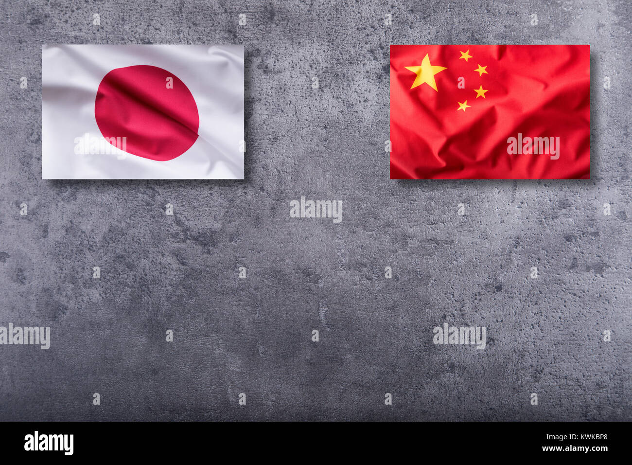 China And Japan Flags China And Japan Flag On Concrete Background Stock Photo Alamy