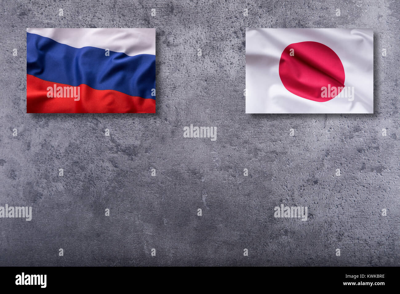 Russia And Japan Flags Russia And Japan Flag On Concrete