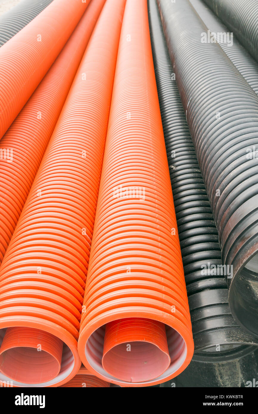 Construction orange and black plastic pipes Stock Photo Alamy