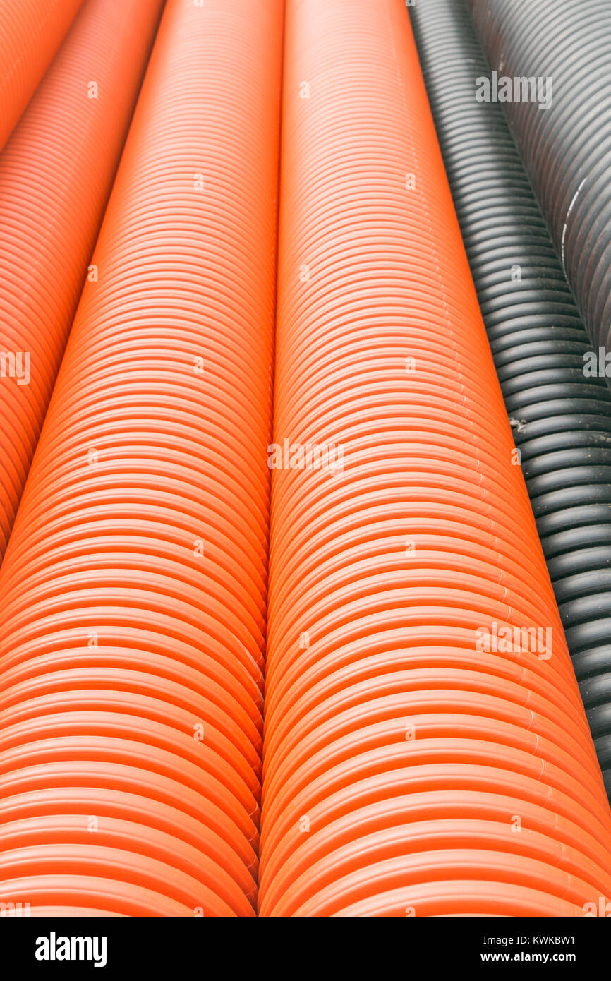 Construction orange and black plastic pipes Stock Photo Alamy