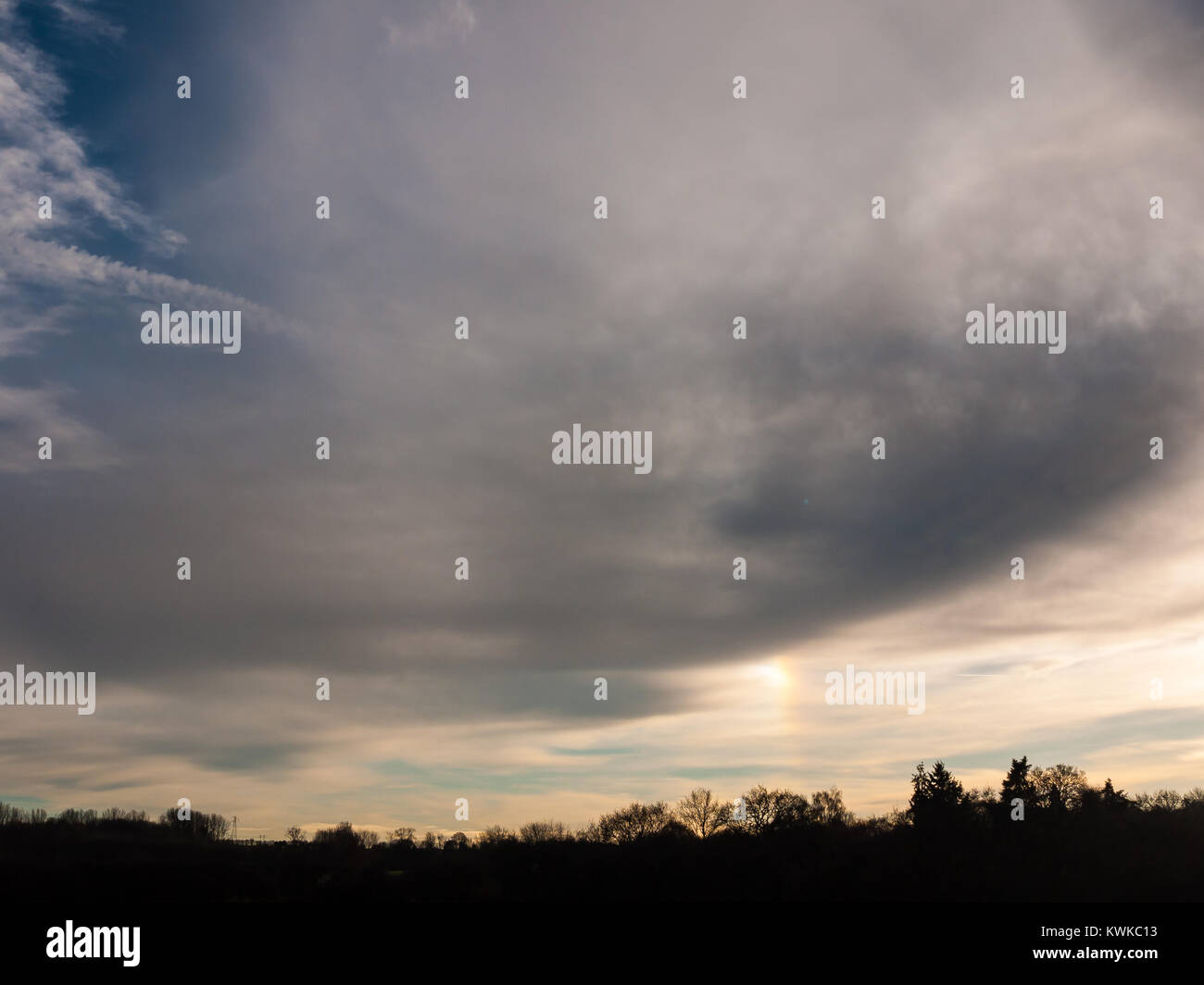 dark cloudy moody sky over tree line silhouette background landscape ...