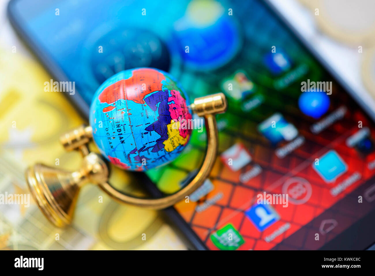 Globe on smartphone, symbolic photo Roaming fees, Globus auf Smartphone, Symbolfoto Roaming-Geb?hren Stock Photo