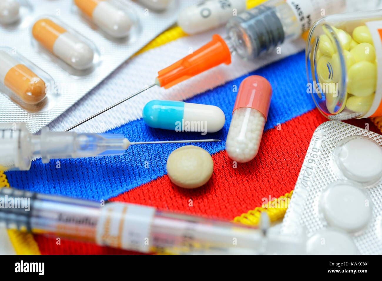 Tablets and syringes on Russia flag, doping scandal, Tabletten und Spritzen auf Russland-Fahne, Doping-Skandal Stock Photo