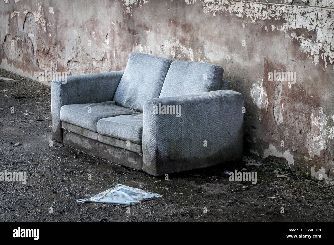 Old couch wet and destroyed Stock Photo - Alamy