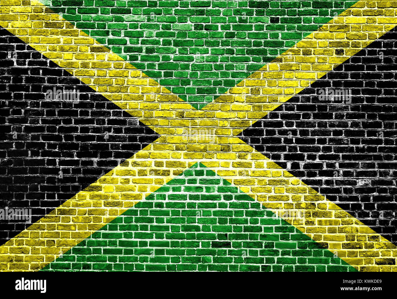 Flag of Jamaica painted on brick wall, background texture Stock Photo