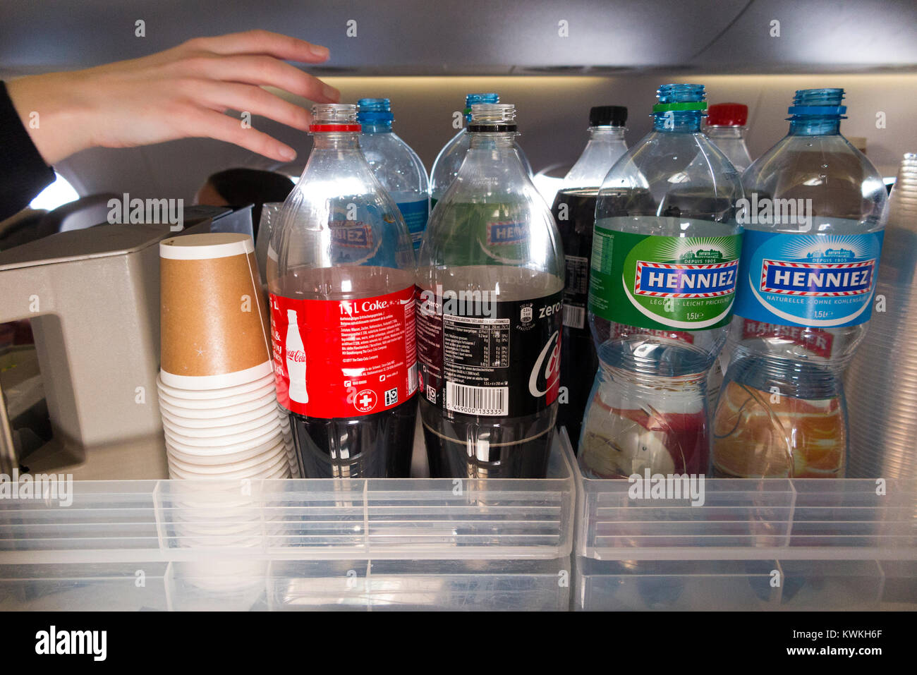 A drink trolley in the aisle on an Embraer 190 plane / aeroplane