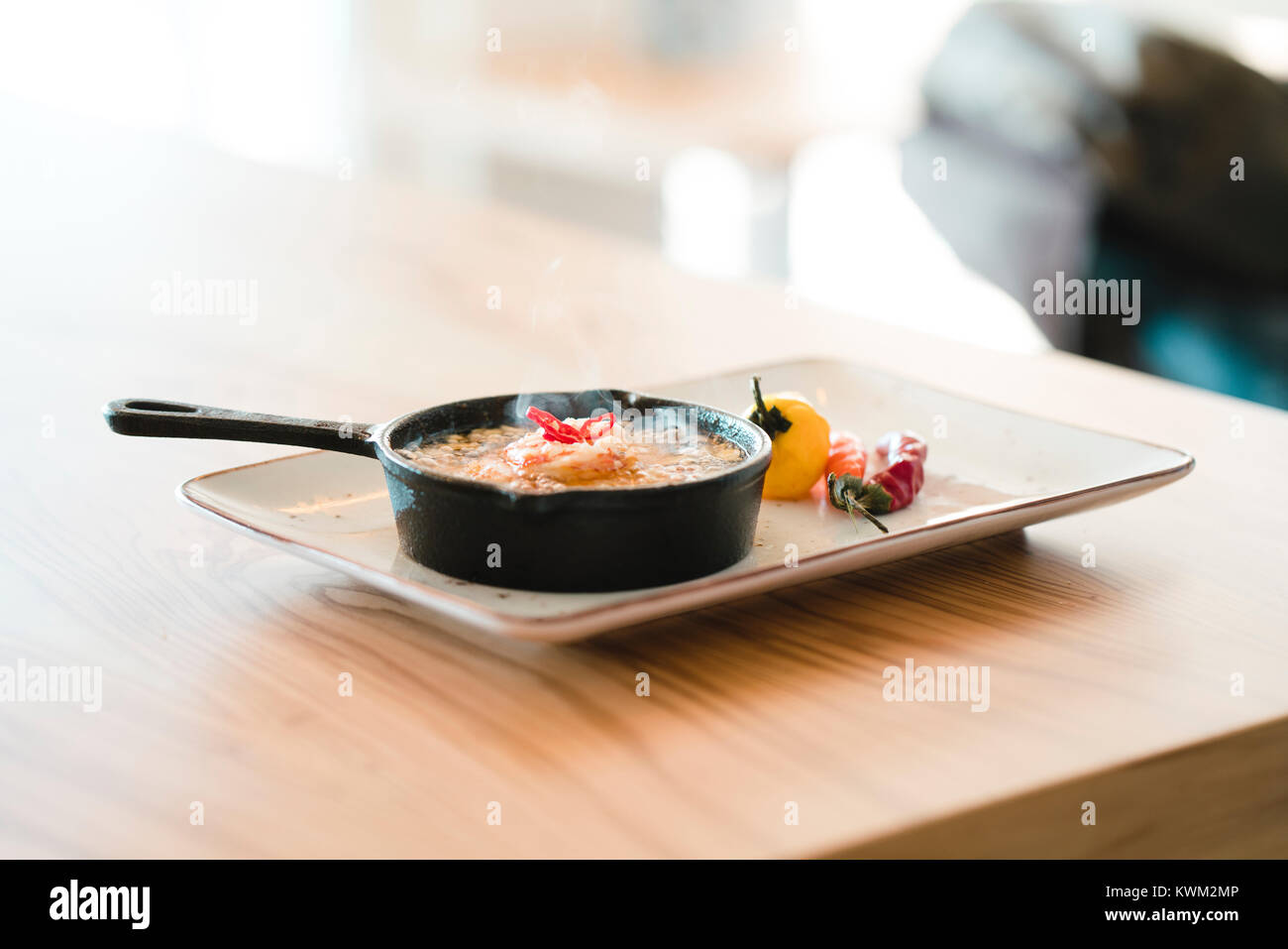 Close-up of hot food in skillet on table Stock Photo