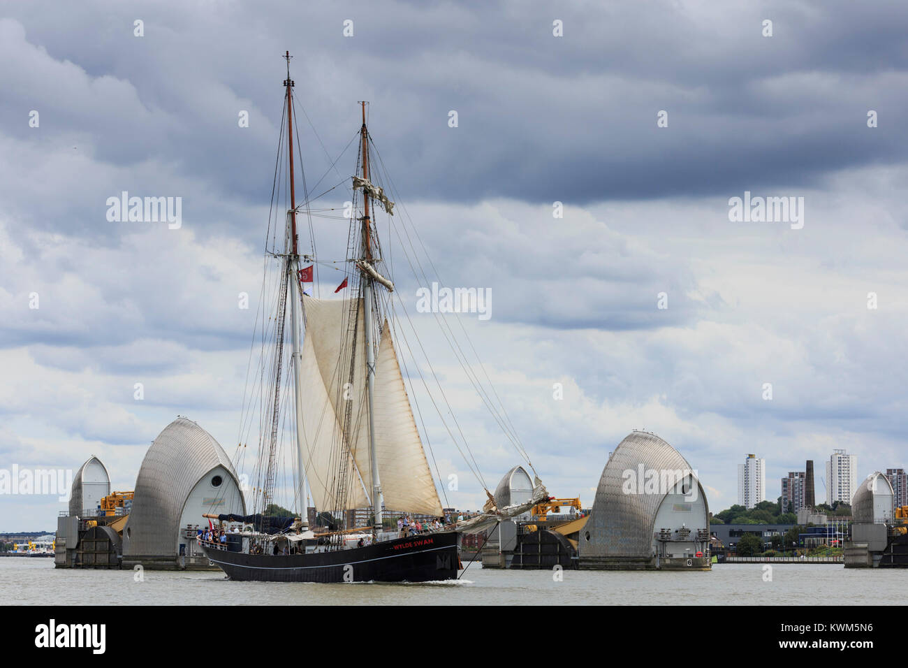 Top sail schooner Wylde Swan passes the Thames Barrier on the River Thames on the first day of the Tall Ships Festival 2015. Stock Photo