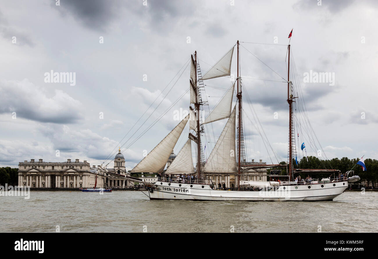 Tall ship J.R. Tolkien passes the Royal Naval College in Greenwich and sails down the River Thames on the first day of the Tall Ships Festival 2015. Stock Photo