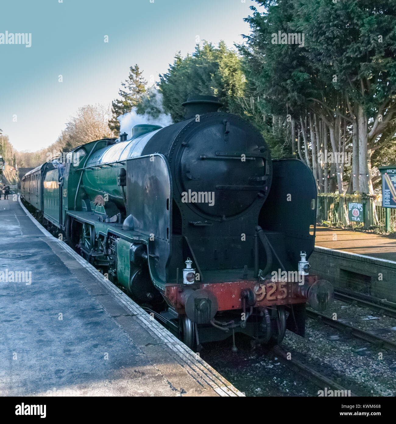 Steam Train - Cheltenham class engine - at Alresford Station on Watercress Line - in winter sun - Square format Stock Photo