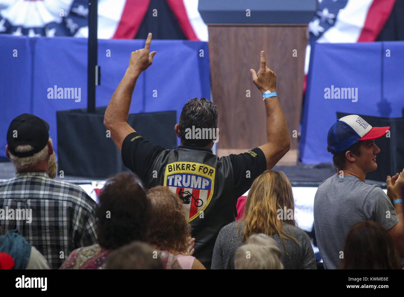 Cedar Rapids, Iowa, USA. 21st June, 2017. A Bikers For Trump rider raises his hands to cheer for the President at a campaign rally at the U.S. Cellular Center in Cedar Rapids on Wednesday, June 21, 2017. Credit: Andy Abeyta, Quad-City Times/Quad-City Times/ZUMA Wire/Alamy Live News Stock Photo
