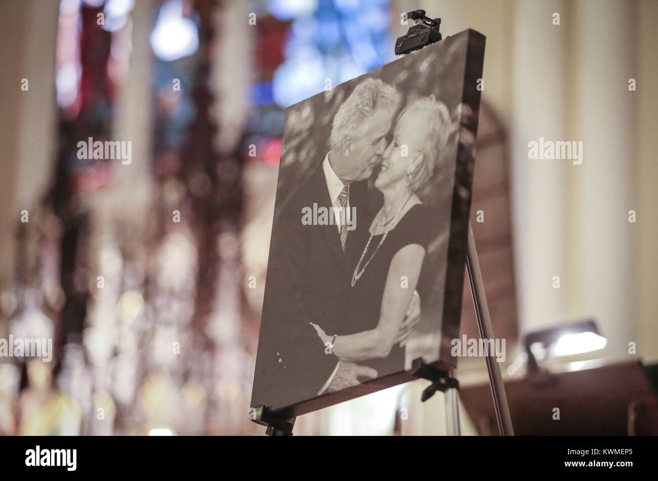 Davenport, Iowa, USA. 24th Sep, 2016. A canvas print of state Rep. Joe Seng and wife, Mary, is seen on display at Sacred Heart Cathedral in Davenport on Saturday, September 24, 2016. The funeral for state Rep. Joe Seng, 69, who died Sept. 16 of a brain tumor was held before a number of family members, friends, and colleagues. Credit: Andy Abeyta/Quad-City Times/ZUMA Wire/Alamy Live News Stock Photo