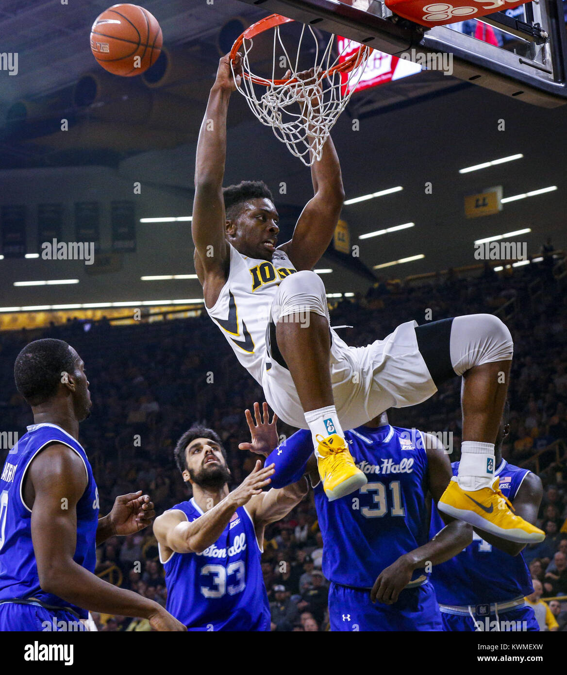 Iowa City, Iowa, USA. 17th Nov, 2016. Iowa forward Tyler Cook (5) hangs on the rim after a dunk during the first half of their game at Carver-Hawkeye Arena in Iowa Cityon Thursday, November 17, 2016. Credit: Andy Abeyta/Quad-City Times/ZUMA Wire/Alamy Live News Stock Photo
