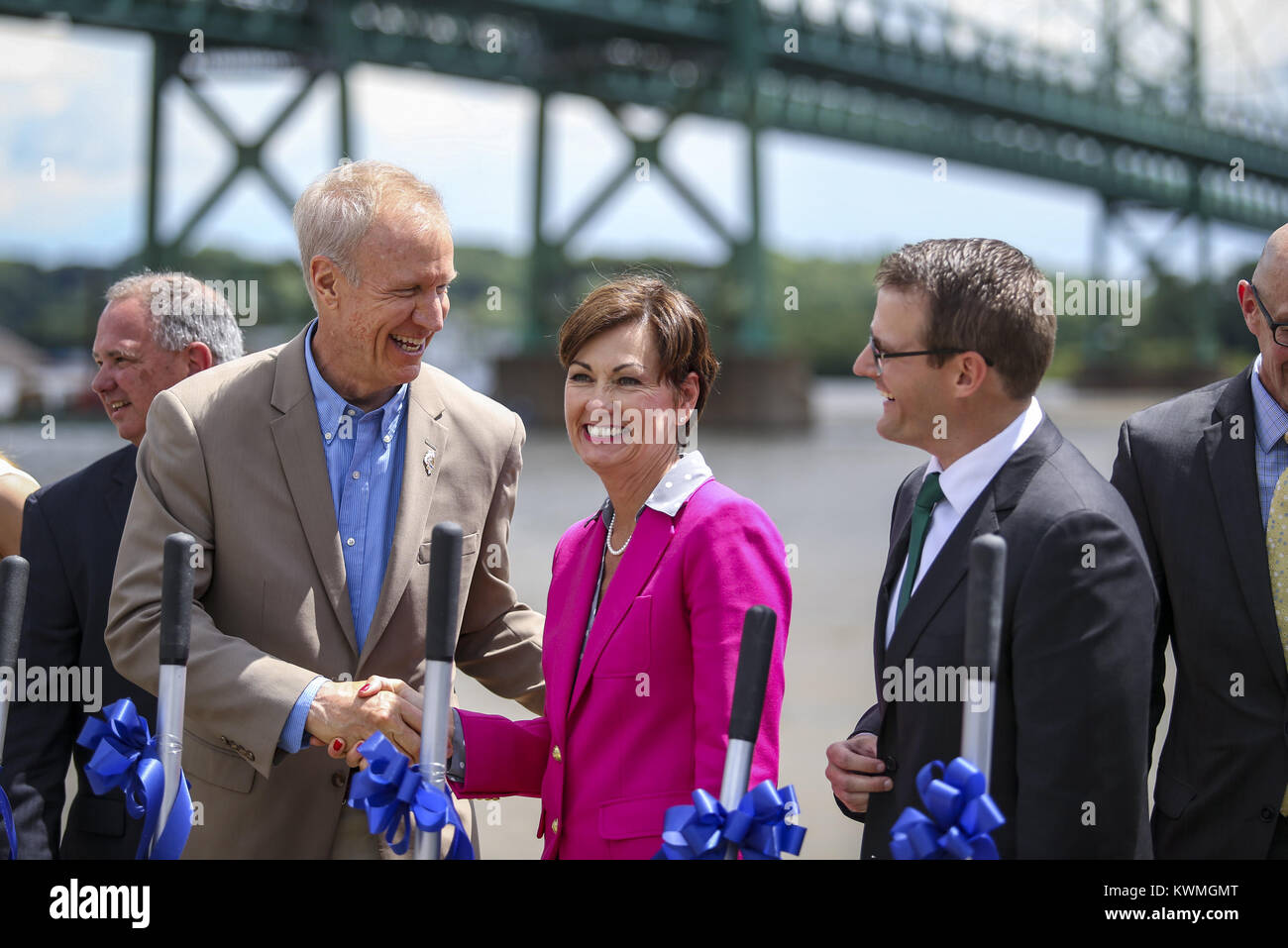 Bettendorf, Iowa, USA. 26th June, 2017. Illinois Gov. Bruce Rauner, left, and Iowa Gov. Kim Reynolds shake hands during the I-74 Bridge Reconstruction Groundbreaking at Leach Park in Bettendorf on Monday, June 26, 2017. Credit: Andy Abeyta, Quad-City Times/Quad-City Times/ZUMA Wire/Alamy Live News Stock Photo