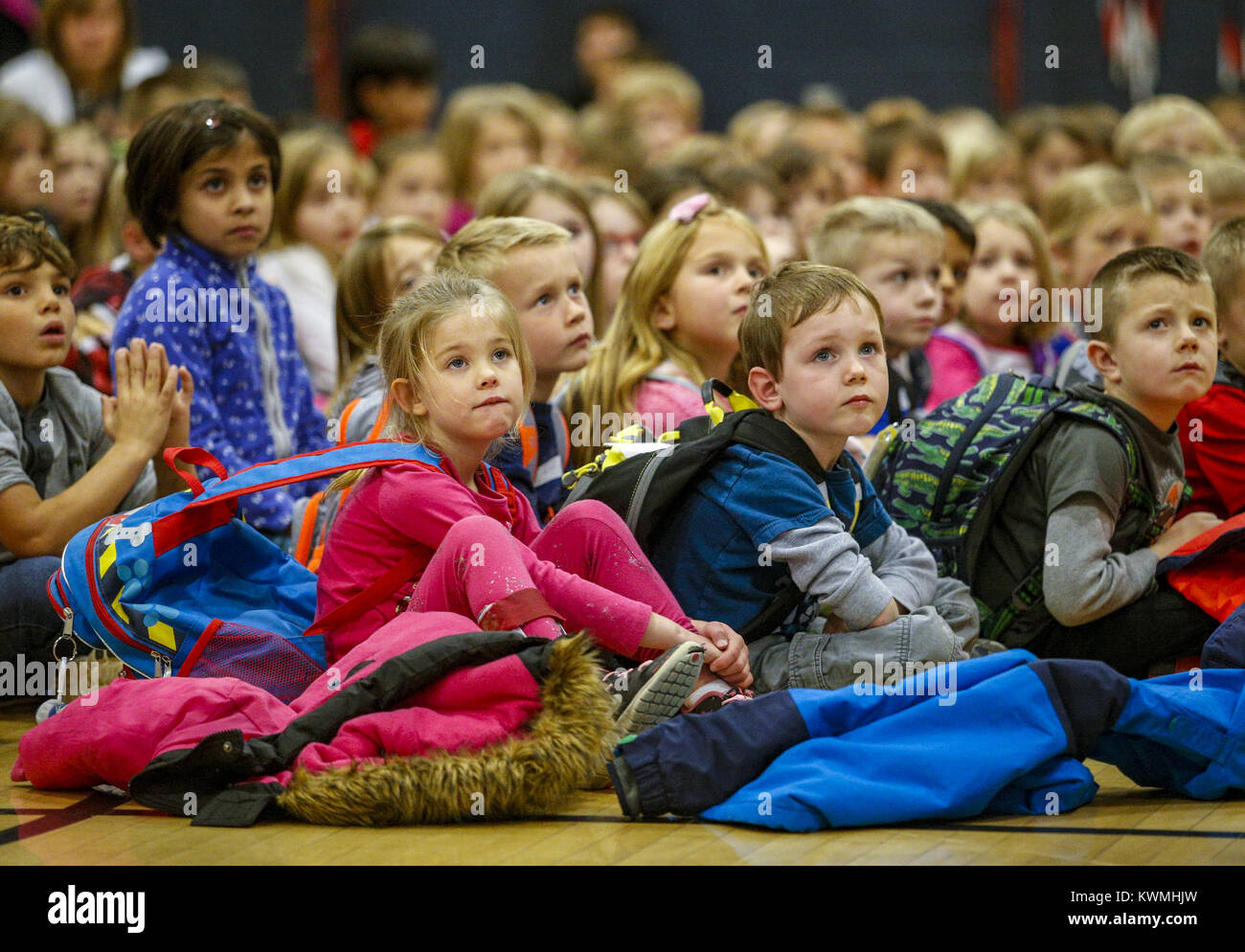 Le Claire, Iowa, USA. 30th Nov, 2016. Students at Cody Elementary School sit on the gymnasium floor listening to the Shamrell family speak about their foundation in Le Claire on Wednesday, November 30, 2016. Cody Elementary School held an assembly to kick off the Caleb's Alive In Me Foundation annual toy and book drive to benefit pediatric hospital patients. The foundation was named for Caleb Shamrell who died from tonsillectomy complications a day before his 3rd birthday. Credit: Andy Abeyta/Quad-City Times/ZUMA Wire/Alamy Live News Stock Photo