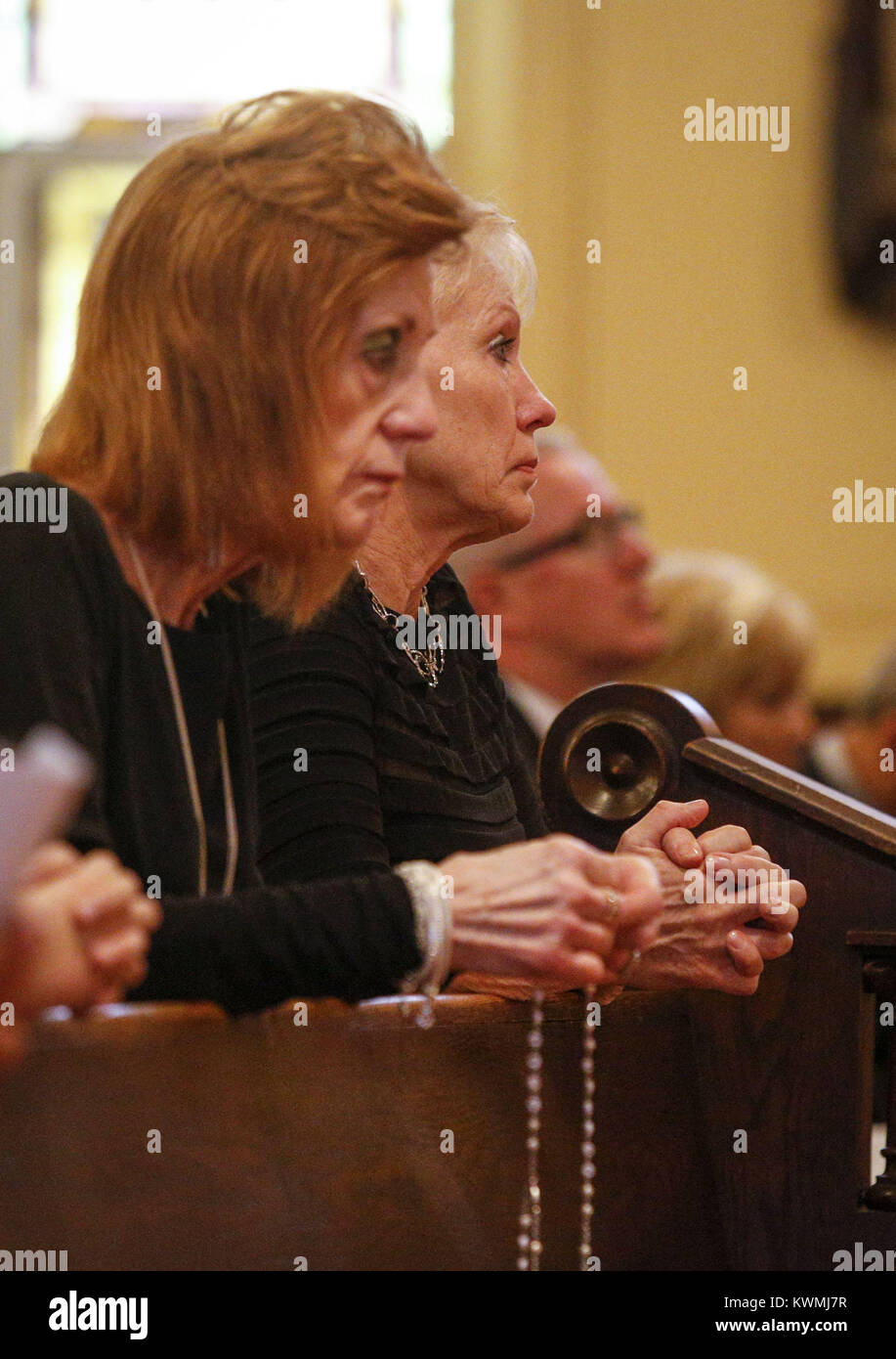Davenport, Iowa, USA. 24th Sep, 2016. Mary Seng, wife of state Rep. Joe Seng, listens to a prayer lead by Fr. Richard Adam at Sacred Heart Cathedral in Davenport on Saturday, September 24, 2016. The funeral for state Rep. Joe Seng, 69, who died Sept. 16 of a brain tumor was held before a number of family members, friends, and colleagues. Credit: Andy Abeyta/Quad-City Times/ZUMA Wire/Alamy Live News Stock Photo