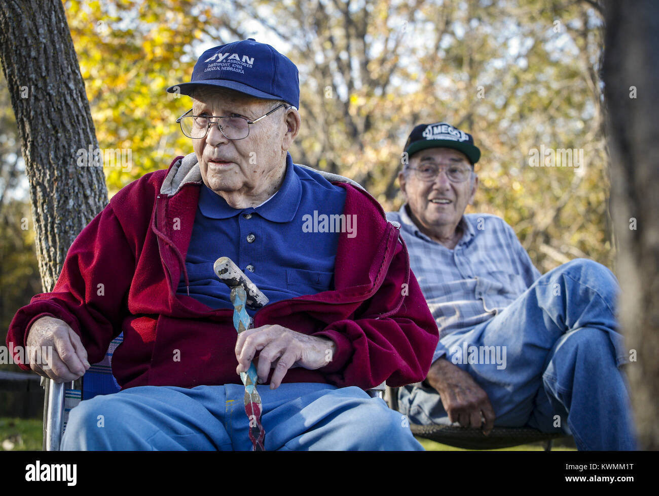 Bettendorf, Iowa, USA. 22nd Oct, 2016. Bob Tucker, 93, of Davenport sits with Earl Hill, 88, of Davenport around the campfire after a hike in Blue Grass on Saturday, October 22, 2016. The Black Hawk Hiking Club hiked among six miles of trails on a 250-acre plot of private property near Blue Grass. The club is approaching its 97th year and 2,550th hike as a club. Credit: Andy Abeyta/Quad-City Times/ZUMA Wire/Alamy Live News Stock Photo