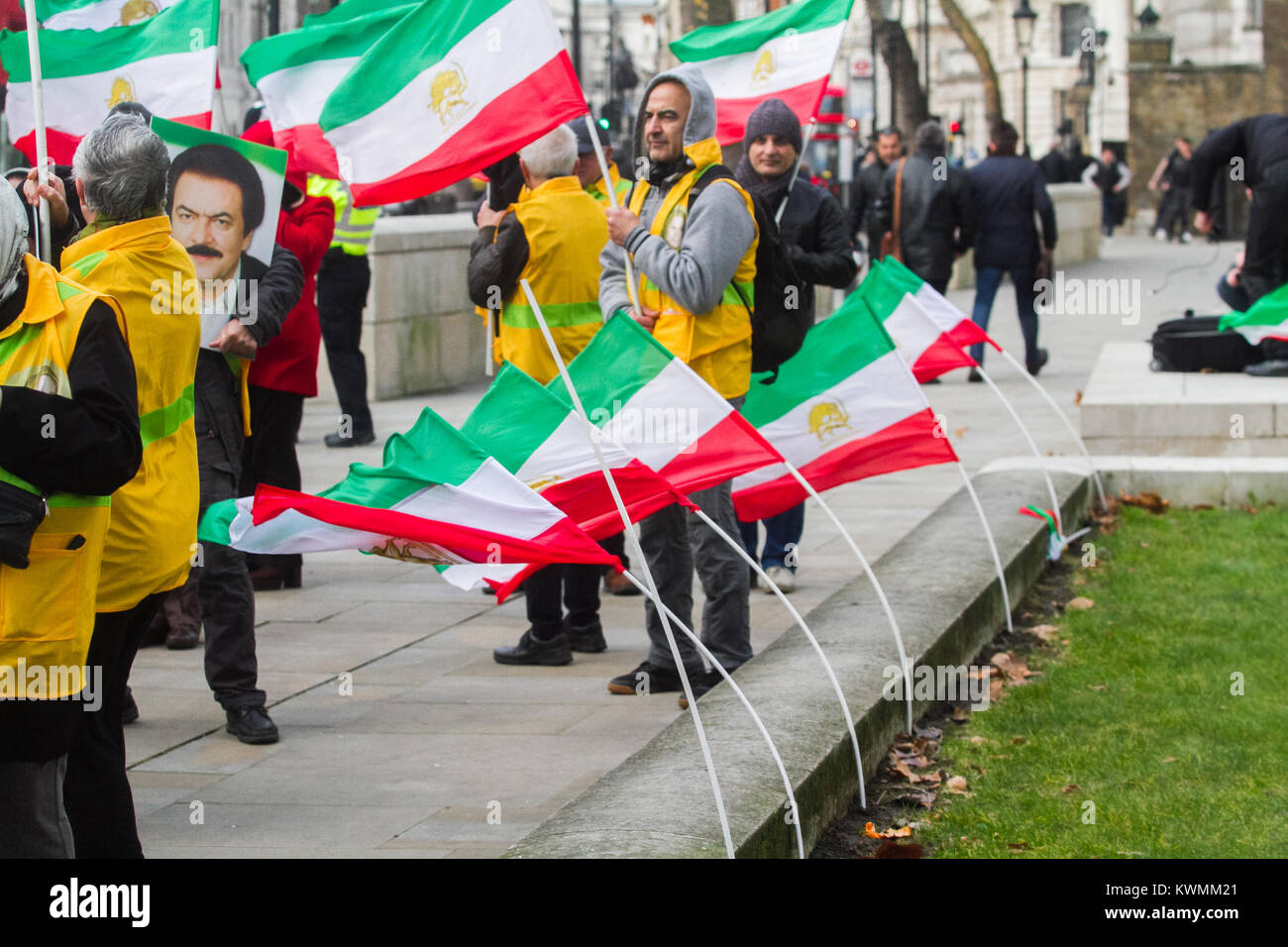 London UK. 4th January 2018. A rally outside No 10 Downing Street  by members of Iran's opposition, the National Resistance of Iran (NCRI) and the People's Mojahedin Organization of Iran (PMOI/MEK)calling on the UK Government to break its silence and condemn the killings and crackdown of protesters by the Iranian clerical regime of President Rouhani and Supreme leader  Ayatollah Ali Khamenei Stock Photo