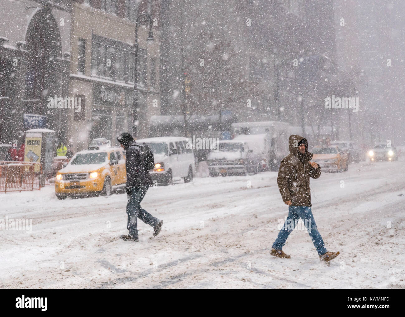 New York, USA, 4 Jan 2018.  People cross 86th Street under a  heavy snowstorm which meteorologists called 'bombogenesis' or 'bomb cyclone',  that brought record snow, bitter cold and strong winds over New York on January 4, 2018. Photo by Enrique Shore/Alamy Live News Stock Photo