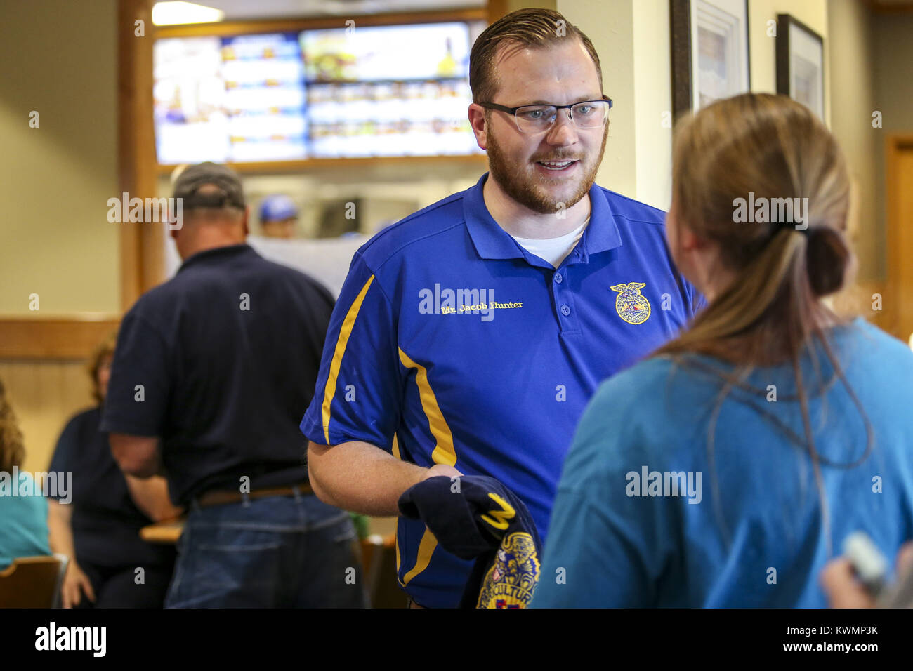 Bettendorf, Iowa, USA. 28th Sep, 2017. FFA teacher Jacob Hunter talks to a student at Culver's in Bettendorf on Thursday, September 28, 2017. North Scott FFA and agricultural students held a fundraiser at Culver's in Bettendorf benefitting from a percentage of sales from the night as well as having a few games for kids to learn about FFA. Credit: Andy Abeyta, Quad-City Times/Quad-City Times/ZUMA Wire/Alamy Live News Stock Photo