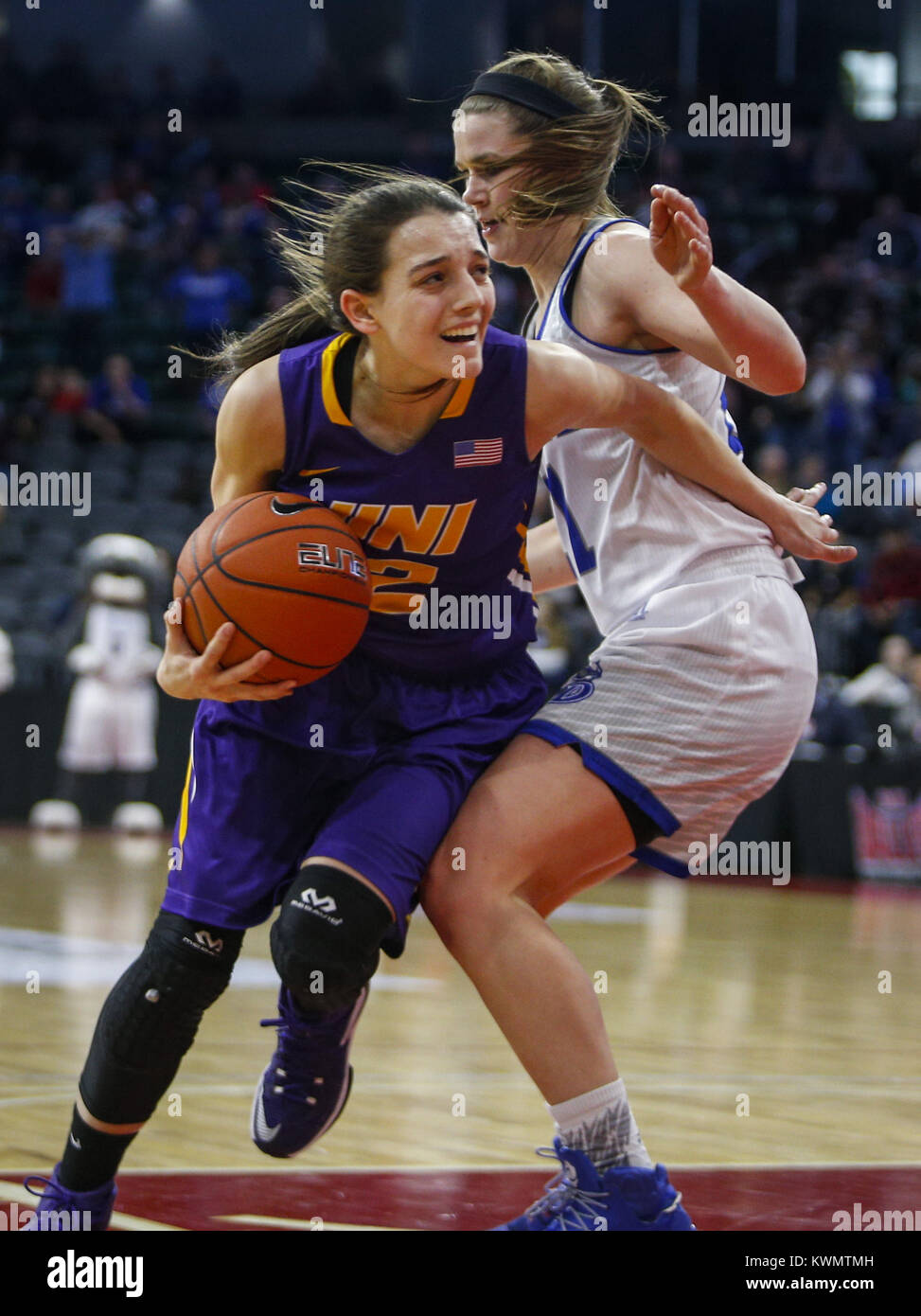 Moline, Iowa, USA. 12th Mar, 2017. Drake's Sammie Bachrodt (21) guards Northern Iowa's Madison Weekly (2) as she works toward the hoop during overtime at the iWireless Center in Moline on Sunday, March 12, 2017. After trailing much of the game, Drake rallied to beat Northern Iowa in overtime, 74-69. Credit: Andy Abeyta/Quad-City Times/ZUMA Wire/Alamy Live News Stock Photo