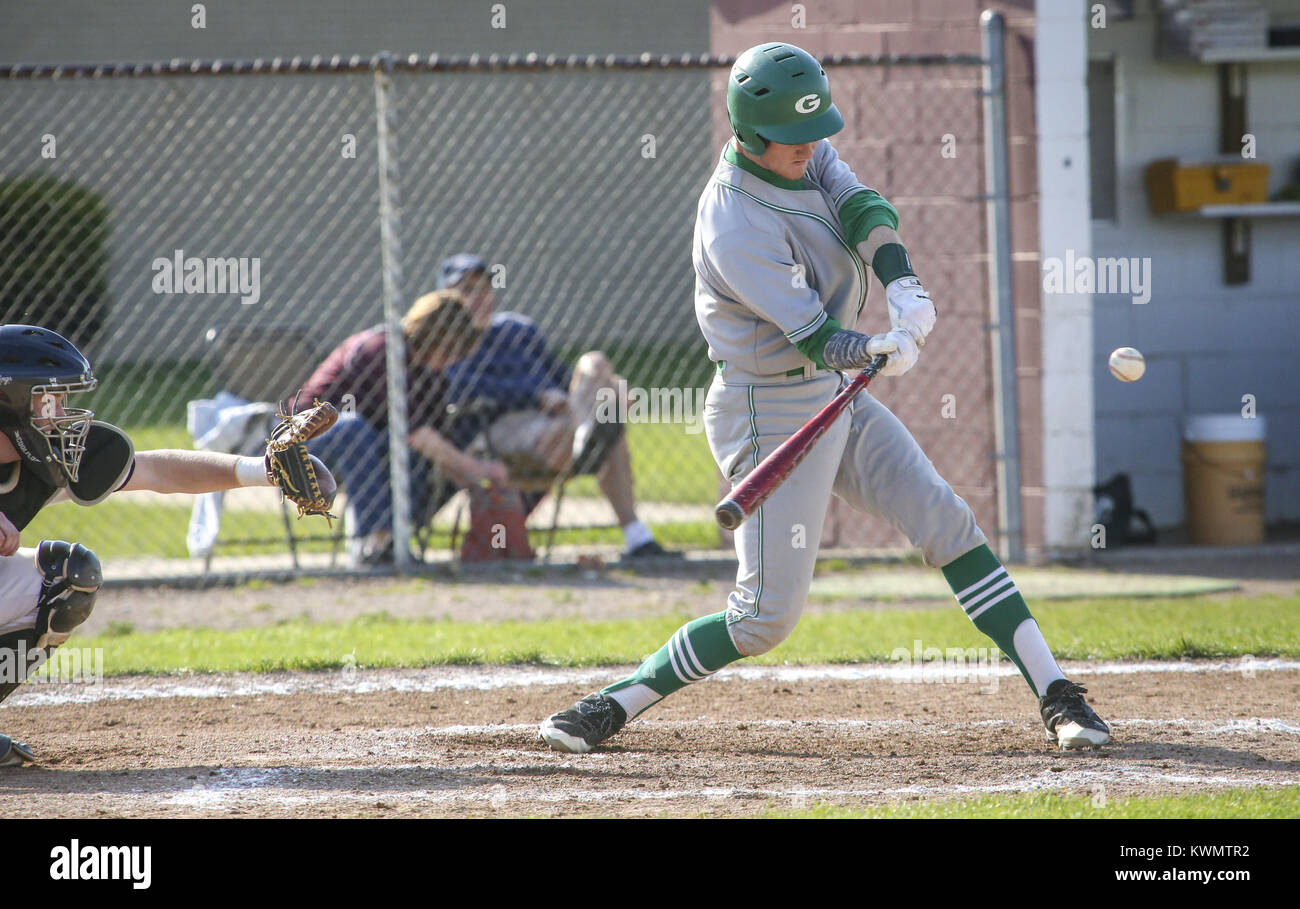 Moline, Iowa, USA. 8th May, 2017. Geneseo's Kyle Toone (12) swings at a ...